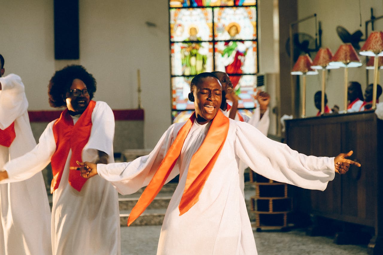 Vibrant church choir singing and dancing with passion in a Lagos church.